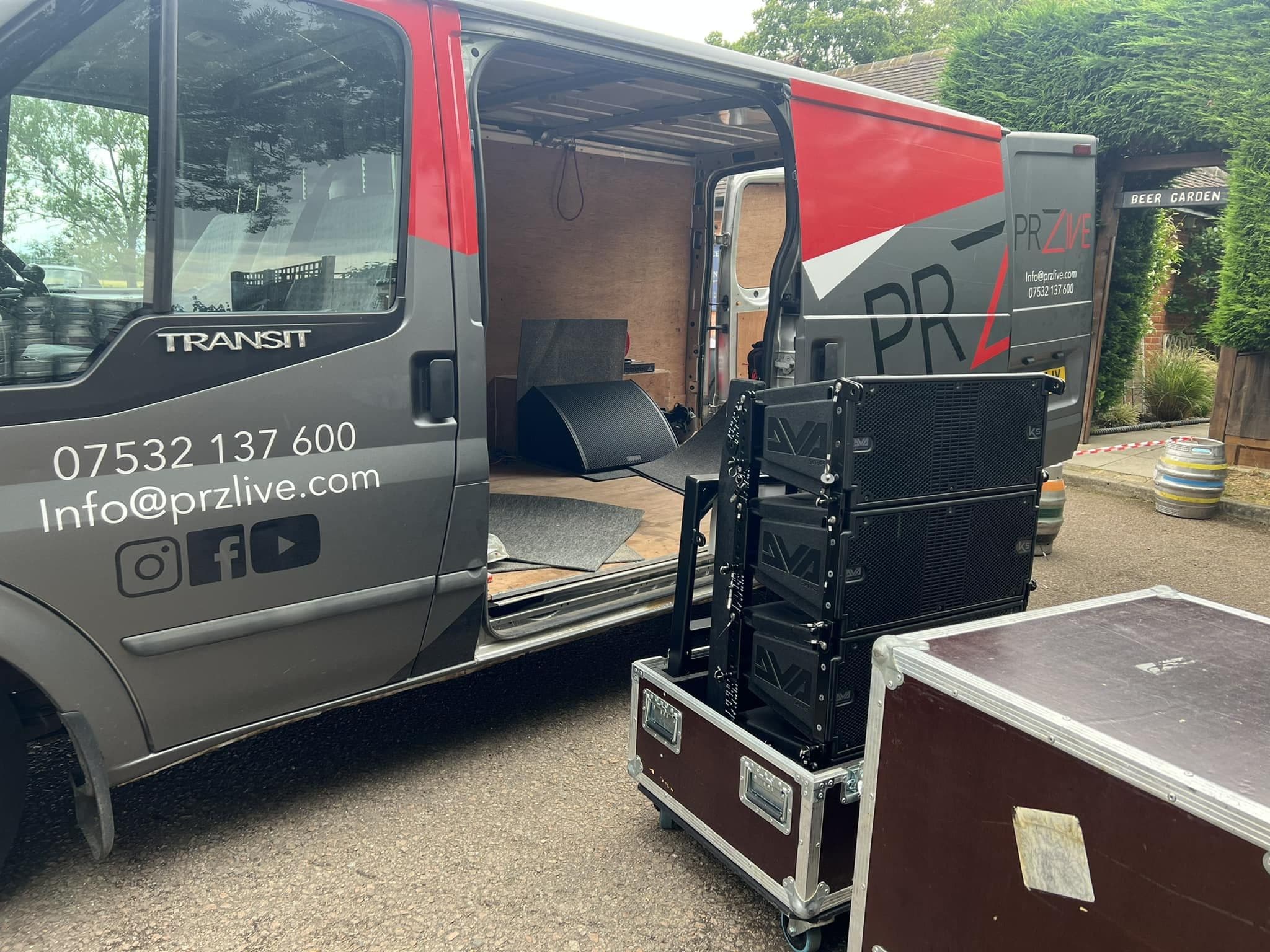 PRZ Live van being loaded with line array speakers and flight cases